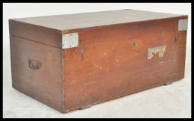 An early 20th Century blanket box, the painted brass bound body with hinged lid to top and latch