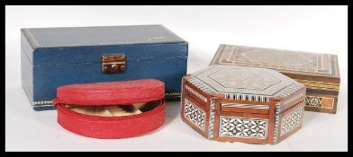 A collection of four 20th Century jewellery boxes to include an inlaid example, ostrich skin example