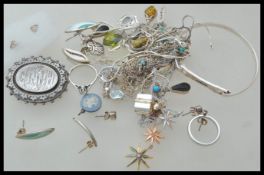 A selection of silver jewellery to include necklace chains, a bangle bracelet, a silver pendant
