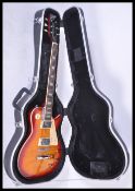 A Vantage made Gibson style electric six string guitar. Flame / Cherry sunburst body, with cream