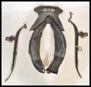 A large 19th Century Victorian leather working horse collar haim together with a pair of 19th