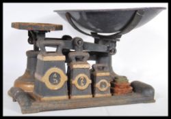 A 19th Century Victorian industrial grocers weighing scales, the balance scales in original ebonised