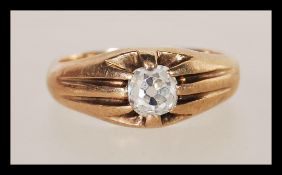 A 9ct gold single stone ring having an old cut diamond of approx 50 pts with split shoulders and