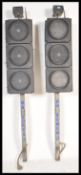 A pair of 20th century Industrial three step traffic lights of smaller form having ebonised covers