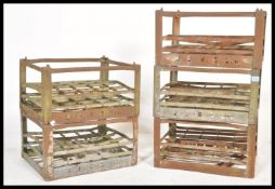 A set of five vintage retro 20th Century sheet metal bottle racks having pierced notation for JJ&S