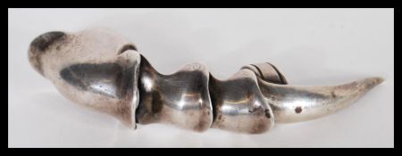 A large sterling silver finger claw / ring having articulated joints. Stamped 925. Weighs 39