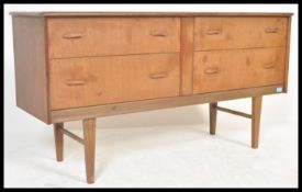 A vintage Danish influence retro 20th Century teak wood sideboard of small proportions having four