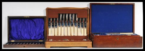 Three wooden cased canteen of cutlery / flatware to include an Elkington and Co Ltd six knife and