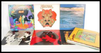 A collection of long play LP vinyl records recorded by Santana to include Festival, Amigos,