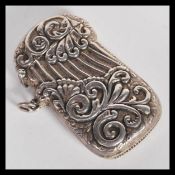 A sterling silver 925 vesta match case having relief scrollwork decoration and hinged lid. Weighs 29