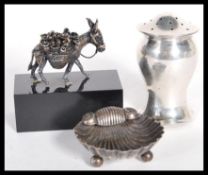 A hallmarked silver small trinket dish in the form of of a shell along with a hallmarked