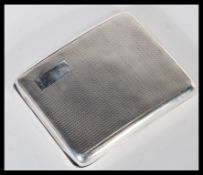 An early 20th Century hallmarked silver cigarette case by Joseph Rogers. The case of curved