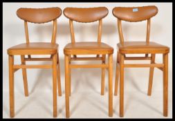 A set of three vintage / retro mid 20th Century beech dining chairs, the beech frames of angular