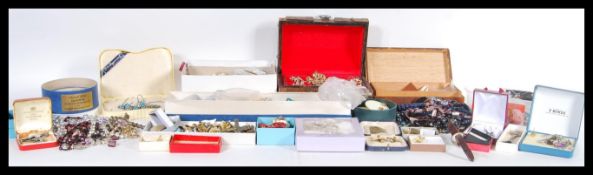 A large collection of vintage costume jewellery to include enamel brooches, art deco cufflinks,