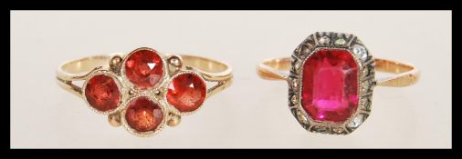 A stamped 9ct gold ring set with four round cut garnet stones (size P.5) along with a stamped 9ct