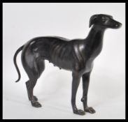 A 20th Century cast iron large heavy figurine of a female greyhound dog or bitch modelled