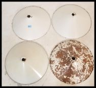 A set of four vintage retro 20th Century industrial factory pendant light shades of UFO form