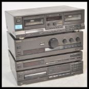 A three piece Technics hi-fi system to include a HX PRO Stereo Double Cassette Deck RS-TR313, a