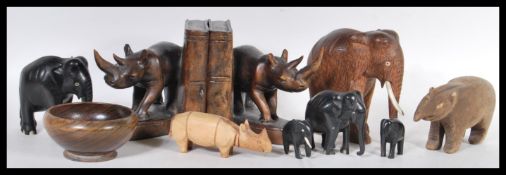 A collection of 20th Century carved wooden items of African items, the items to include a pair of