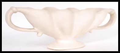 A vintage 20th century cream glazed pottery plant vase, by florist and designer Constance Spry for