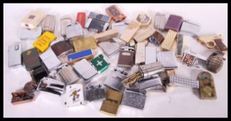 A large collection of vintage lighters to include 3 x Zippo lighters, novelty gun lighters,