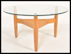 A retro  mid 20th Century teak framed coffee table raise on tapering supports united by stretchers