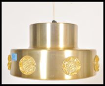 A vintage retro 20th Century two step gold tone ceiling light fixture having applied plastic