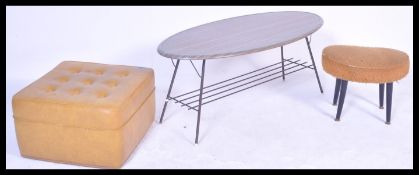 A vintage retro vinyl button back upholstered pouffe by Sherbourne together with a retro coffee