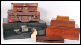 A collection of vintage retro 20th Century leather travel cases of small proportions including a