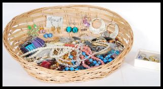 A collection of vintage and contemporary costume jewellery to include rings, faux pearls,