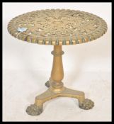 A 19th Century Victorian brass trivet stand table of circular form raised on tripod hairy paw leg