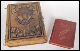 An antique 19th Century Victorian family portrait photograph album along with a Souvenir de l Italie