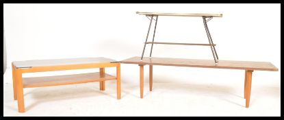 A group of three vintage retro 20th Century teak wood coffee tables comprising of a solid teak