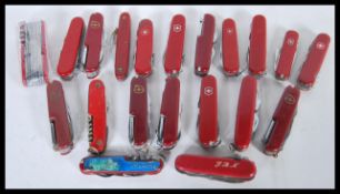 A collection of 20th Century pen knives / pocket knives to include a good selection of red Swiss
