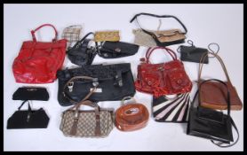 A quantity of vintage 20th Century ladies handbags of various designs to include tote bags, shoulder