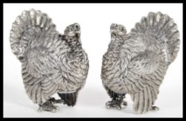 A rare pair of early 20th Century silver plated novelty salt and pepper pots or pepperettes in the