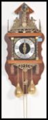 A 20th Century Dutch oak lantern-type Zaanse wall clock, marked around the fret mounts 'Nu Elck