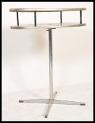 A vintage retro 20th Century 1960's two tier table of circular form having blue formica tops