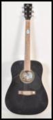 A Quintus German full size six string acoustic guitar having a lacquered black finish with striped
