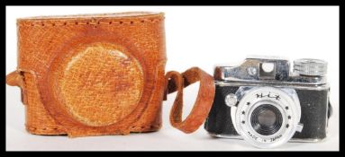 A rare vintage mid 20th Century 1950's Japanese super miniature Hit spy camera complete in leather