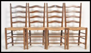 A set of four vintage 20th Century rail back dining chairs, rattan seat pads raised on turned