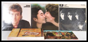 A collection of long play LP vinyl records to related to The Beatles to include The Beatles Box From