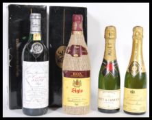 A group of wine and champagne to include two boxed Rioja Siglo wines, Moet and Chandon half bottle