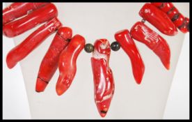 A large red coral festoon collar necklace with large white metal spring hoop clasp. Measures 48cm