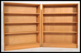 A pair of vintage retro 20th Century Herbert Gibbs signature teak wood open bookcases having