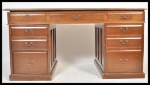 A 19th Century Victorian oak Partners desk, brown leather inset skiver, each side with one long
