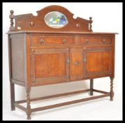 An early 20th Century Art Deco 1930's golden / honey oak sideboard, raised on barley twist legs with