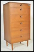 A vintage / retro 20th Century teak chest of six long graduating drawers raised on four square