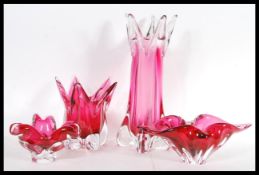 A set of four 20th Century Murano Sommerso studio art glass pieces in cranberry colourways