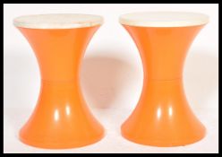 A pair of vintage 1960's Habitat Tam Tam stools in a two tone colourway, the inverted body of the